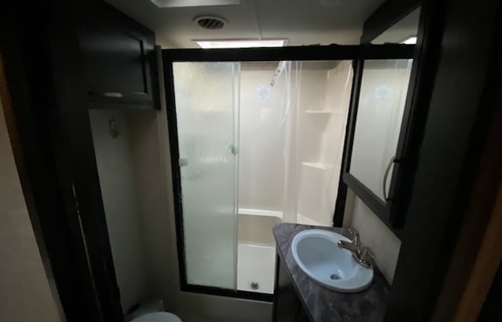 3rd sliding glass door is broken, so it uses 2 glass and a small shower curtain.   Does not impact ability to shower, just cosmetics.  Hope to repair as soon as the right glass is available.