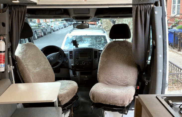 Both front seats have sheep's skin covers. Space inside for 4 adults, or rotate the driver's seat to make a 3rd bed.