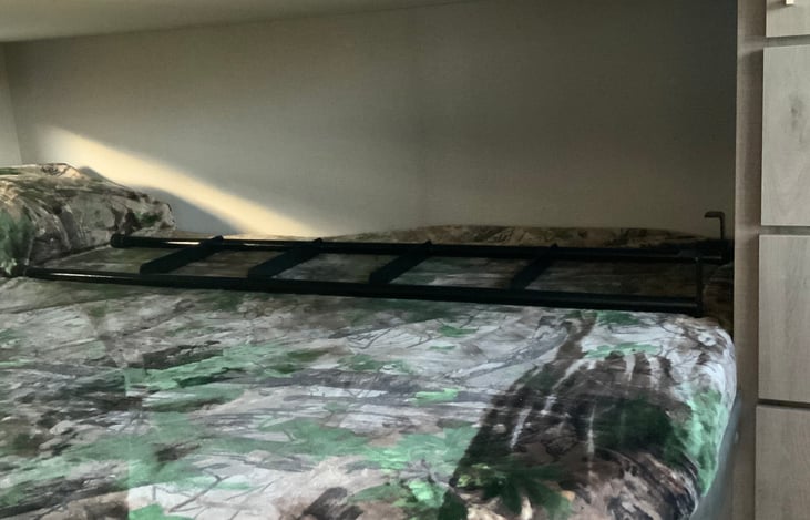 Bunk beds, both have lights and a window.  Ladder included and 2 pillows each with sheets and blanket.