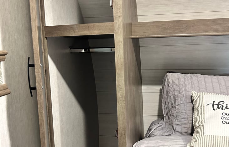 Private bedroom closet on both sides of bed
