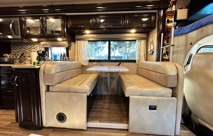 Dinette comfortably seats 4. Makes into sleeping area. Small for adult but good for children