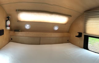 Cozy off-the-ground sleeper with kitchen