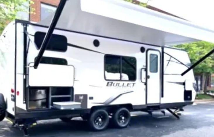 The exterior is a perfect blend of functionality and outdoor enjoyment. With its convenient awning, you can create a shaded oasis, allowing you to relax and dine comfortably outside.