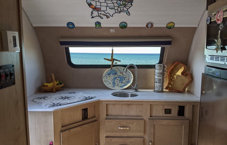 2 burner stovetop, sink, refrigerator, microwave, and tons of counter space!