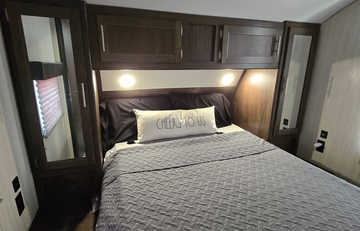 Master Bedroom - all of our beds have memory foam toppers, to improve your sleeping experience! No camper mattress back aches with us!