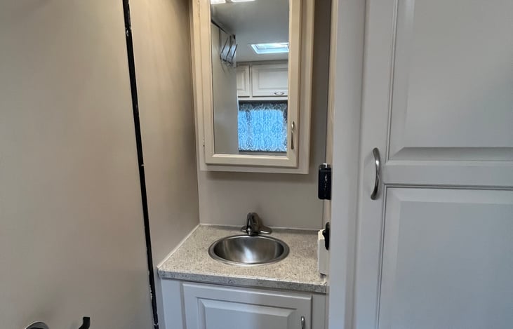 Bathroom sink with medicine cabinet
