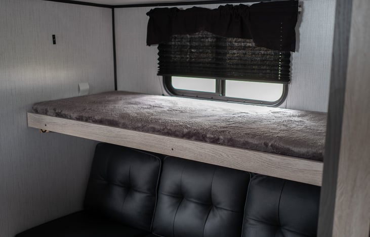 The top fold out bunk in the back room!