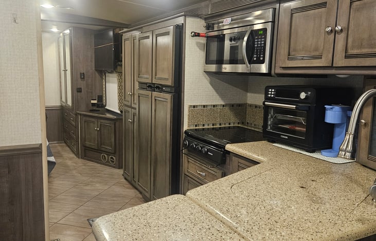 Kitchen, storage and entry to bedroom