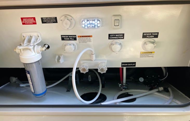 Water supply controls with outboard hot/cold faucet