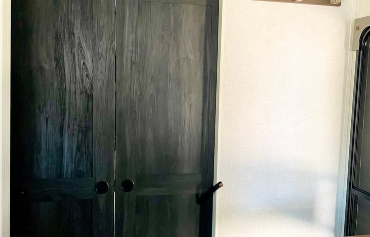 Slide closed the doors to the queen bed for privacy.