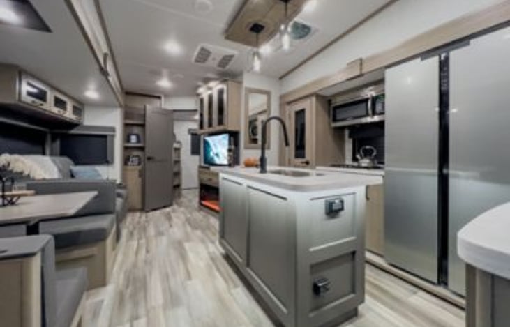 The kitchen has a large freezer and fridge, stove and oven and also a microwave. Plenty of storage too.