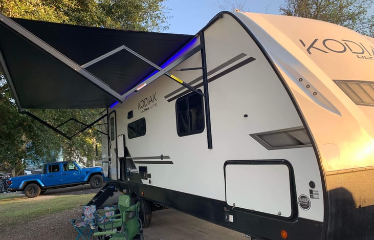 Out door mini fridge next to the cabin door. The Interior TV can be moved and mounted outside very easily. Cable hook ups are also available, so you don't miss the big game while outside cooking!