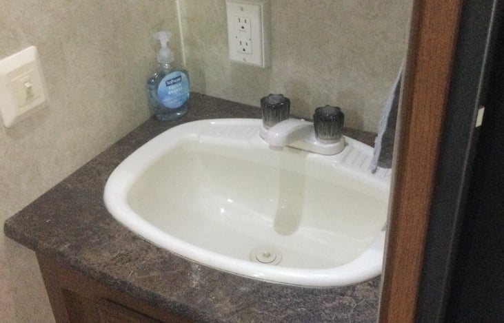 Bathroom Sink with medicine cabinet above