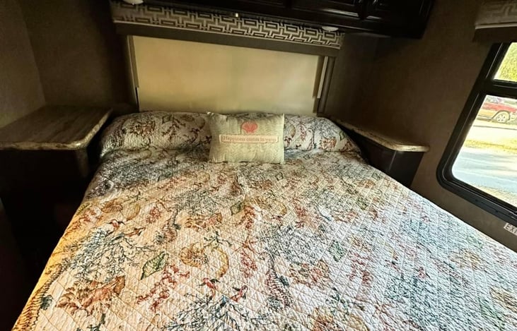 Queen bed in rear bedroom. Not an RV mattress. Very comfortable.