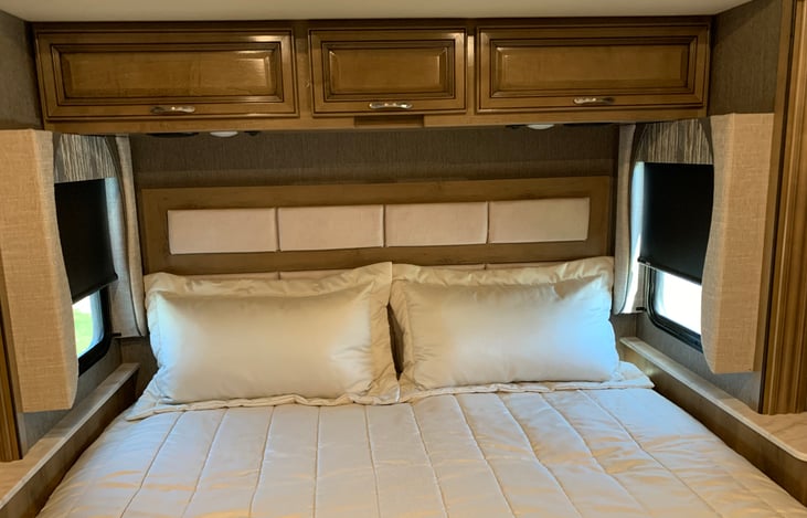 Master bed with storage above & center cabinet for C-Pack