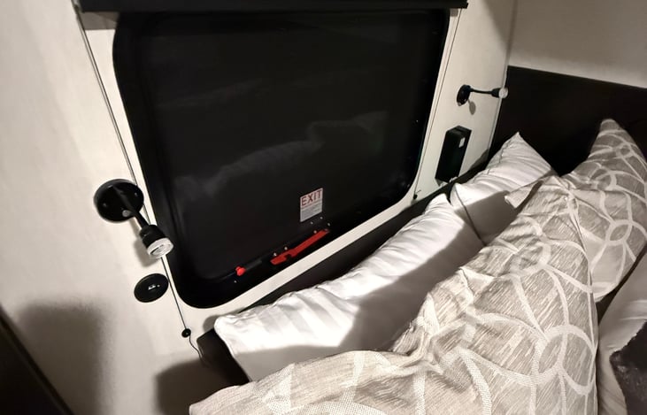 USB chargers and reading lights at head of bed.