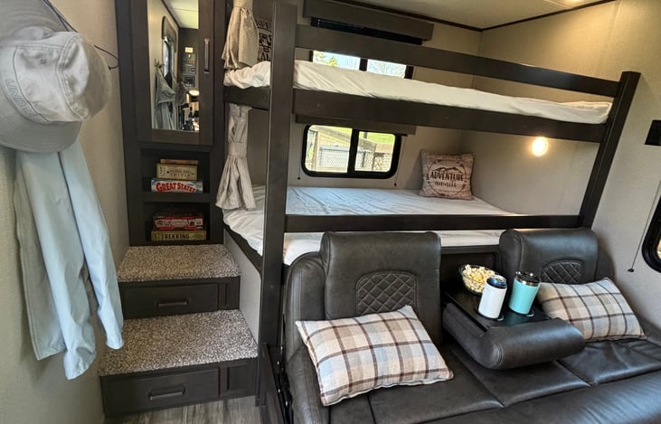 Large bunk beds can easily fit two little kids on each.
More storage under the stairs!!