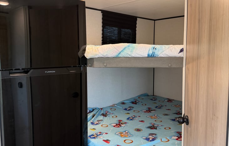 The ultimate kid cave! Spacious double-over-double bunks that the kids (or extra guests) will love.