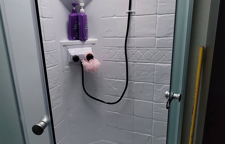 Large shower has plenty of room - even for 6'3" me.