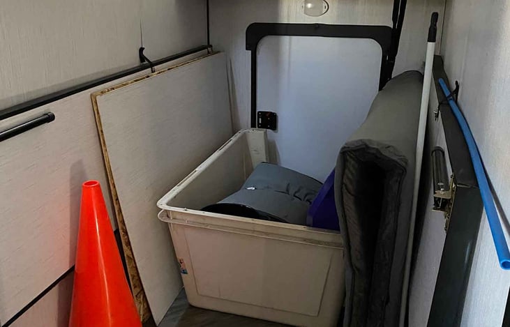 bedroom/storage room. Access rear door. Folded bed to the sides