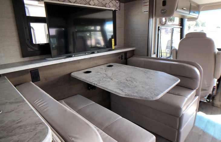 Dinette drops down for a sleeping area.