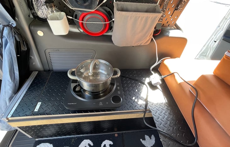 You can safely cook inside of the campervan with 1200W electric induction stove.