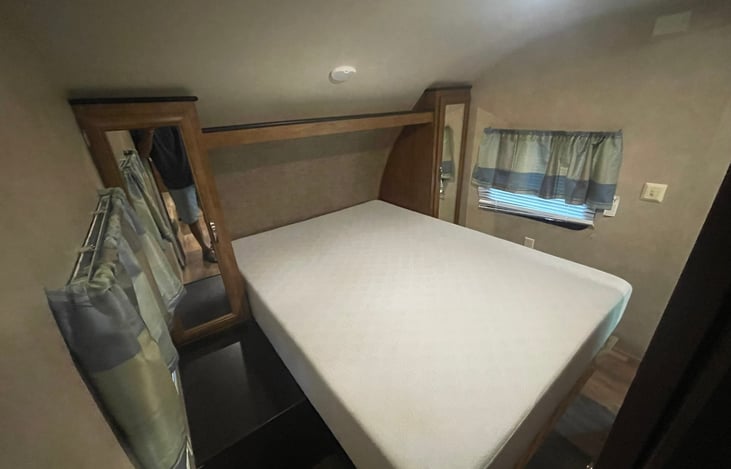 about 8 inch thick Mattress. Queen Bed with his and her storage.