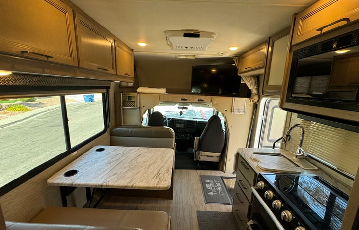 Watch a movie on the manual swivel TV, DVD's included.