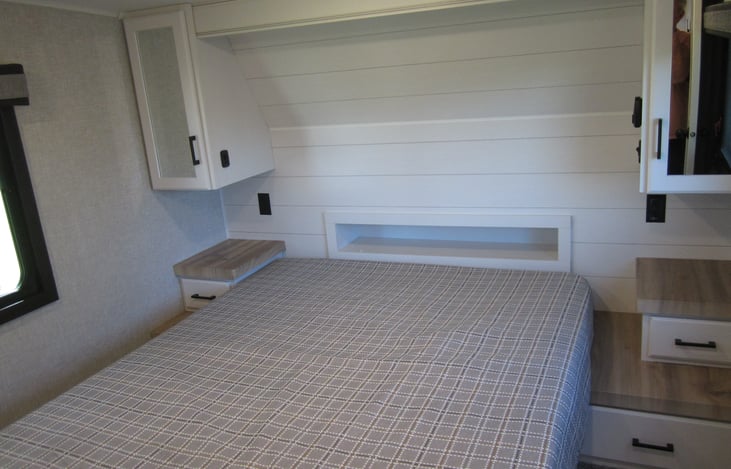 Queen size bed with camper mattress plus 2 " foam pad on top.