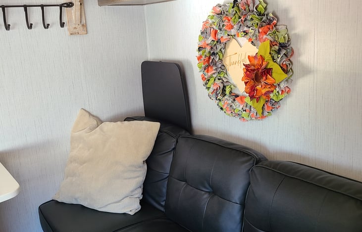 Comfortable couch makes into a bed and has storage underneath.