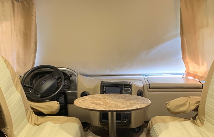 Two captains chairs that rotate to watch TV, eat your meal or converse with your friends and family.