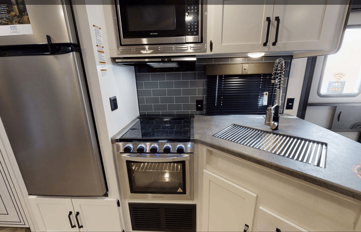 Keurig, toaster, microwave, full, refrigerator, and gas over included.