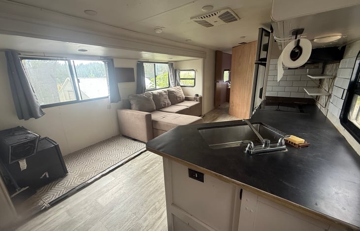 Living room, kitchen, dining. Table can be collapsed for more space in this area, or brought outside.