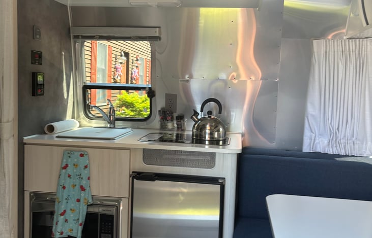 2 burner propane stove with microwave.  Sink and dorm sized fridge