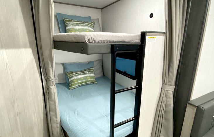 Full bunks with bedding provided. USB charging ports on each bunk as well.