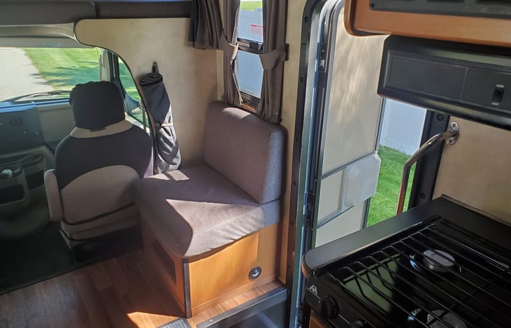 Additional passenger seat and entrance door