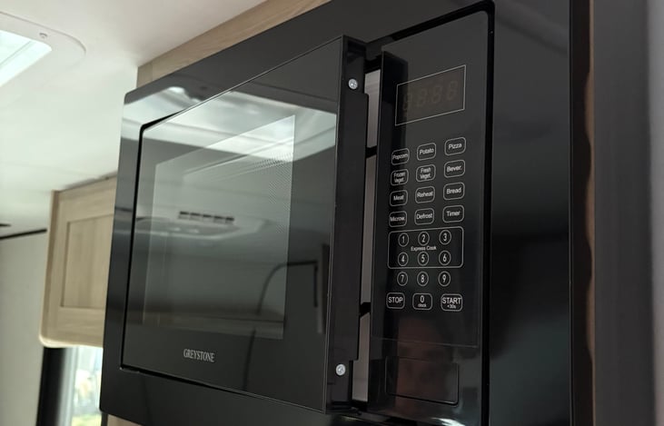 Microwave, don't forget to turn on your generator unless you are hooked up to 30 amps at the RV park. And don't run the AC at the same time!