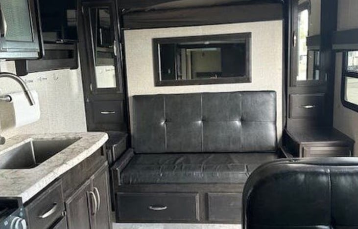 Interior Living Area: Sleek, modern interior with a comfy Murphy bed.