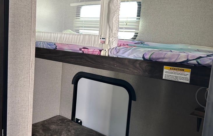 Bunk beds with safety railing.