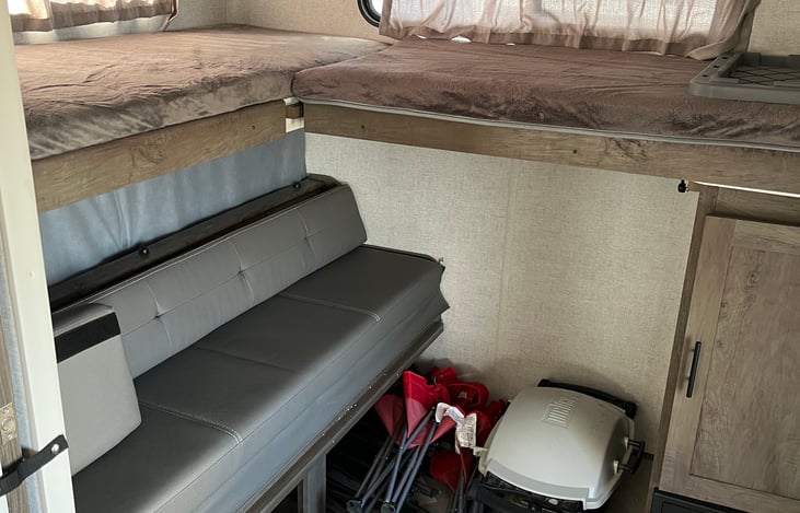 2 full bunks in the back, plus a couch that folds down into a queen size bed.