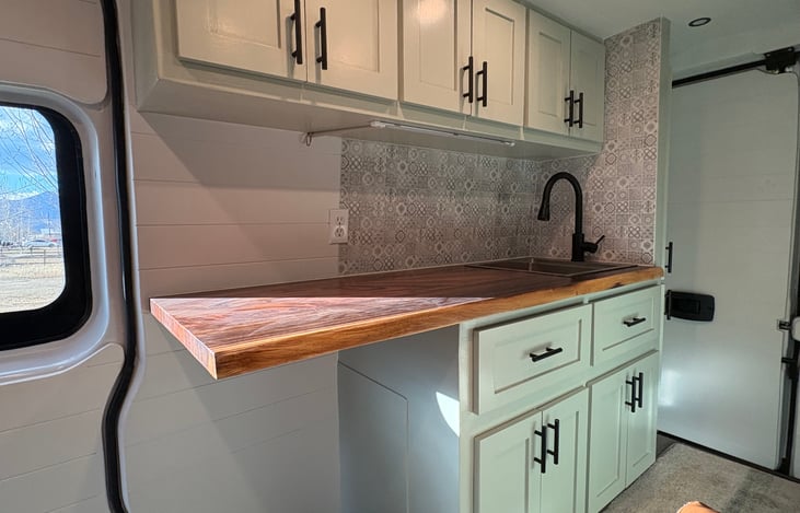 Large counter, lots of storage, deep kitchen sink