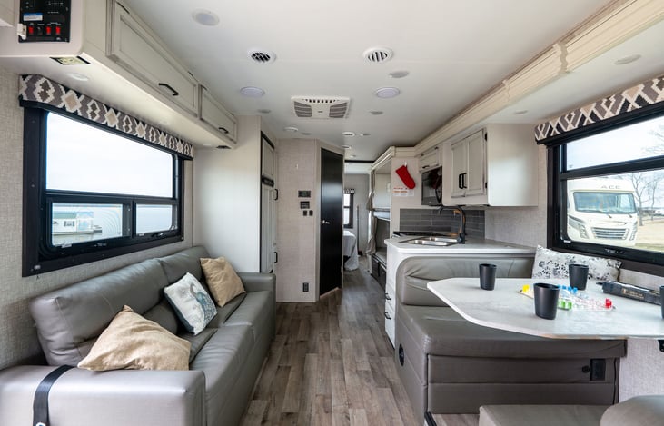 View of the living area. Couch and table turn into beds.