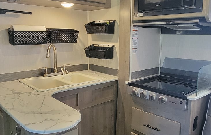 The Bunkhouse has a residential style kitchen, complete with a peninsula for prep space and buffet style meals.