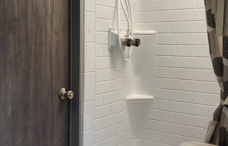 Shower can accommodate a person over 6 feet tall.