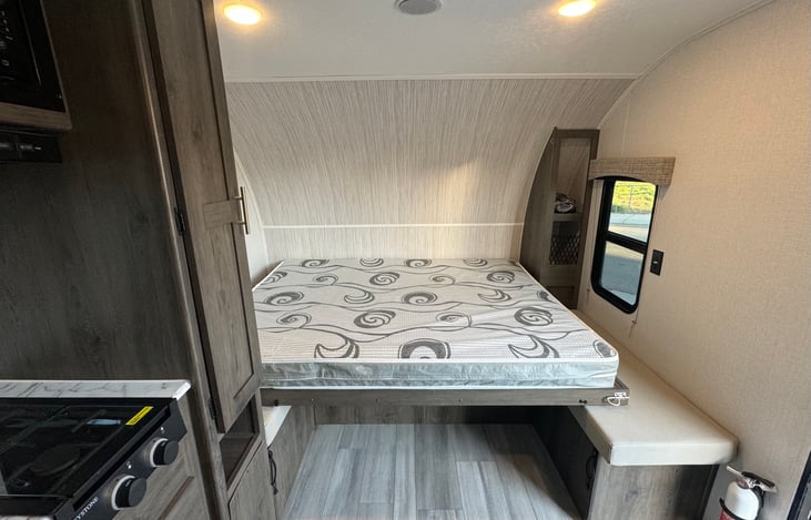 Seating area can also be converted to the main sleeping space with a fold down Murphy bed.