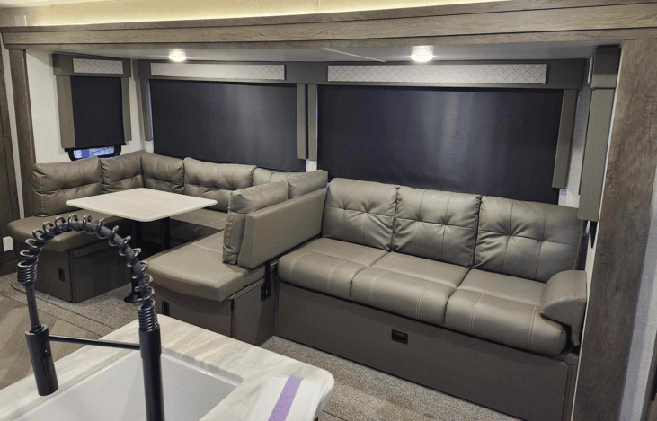 Living room/dining room.  U-shaped dinette converts into a bed as well as jackknife couch.