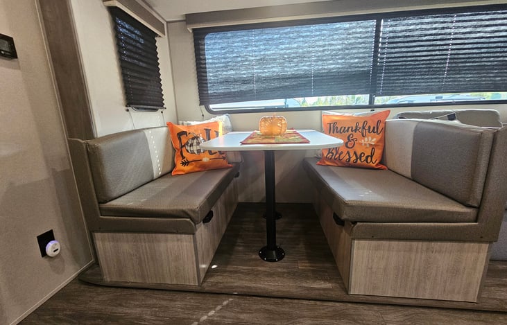 Dinette for rainy day dining or playing games! Folds down for extra sleeping!