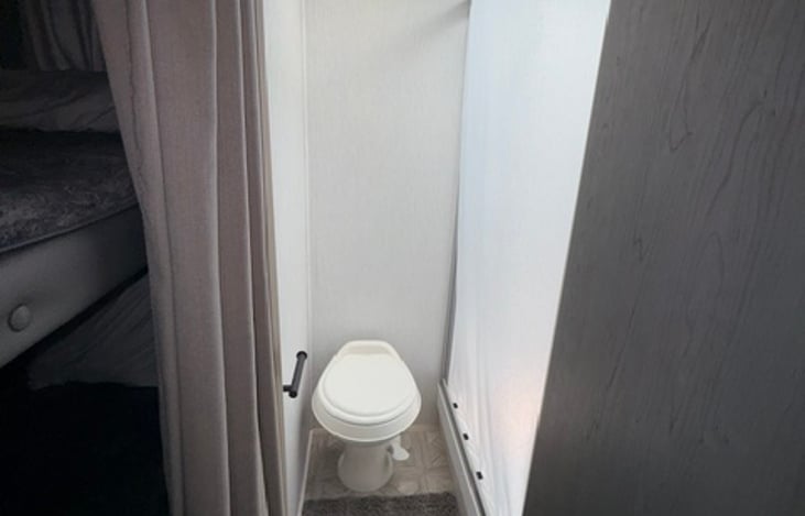 Toilet and spacious shower .