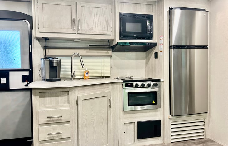 Pots, pans, cooking utensils, plates, cups, bowls, silverware, baking sheet, mixing bowls, hand mixer, instapot, griddle, waffle maker, toaster are all provided. Cleaning supplies also provided.