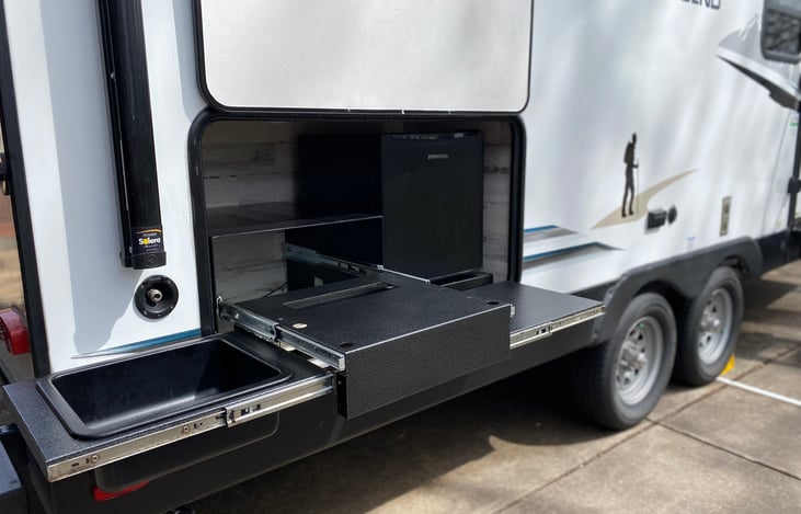 Outdoor kitchen area includes water access, drink fridge and potential add on griddle.